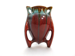 Wonderful Designed Vase supported by three Legs "Faïenceries de Thulin" Belgium 1930s. Color Drip Glaze Technique. Deep red, azure blue and brown.