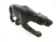 Elegant crouching Panther ready to strike, created by Secondo in France around 1930. Bronze, finished with a green patina.